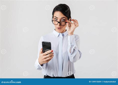 Image Of Joyous Secretary Woman Wearing Eyeglasses Using Smartphone In The Office Isolated Over