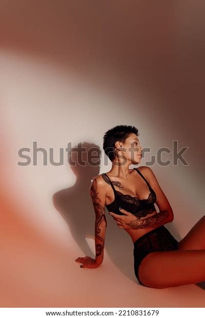 Tattooed Brunette Woman Sexy Lingerie Sitting Stock Photo 2210831679 Shutterstock