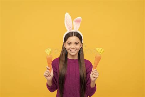 Cheerful Teen Child In Bunny Ears Holding Carrot Easter Holiday Stock