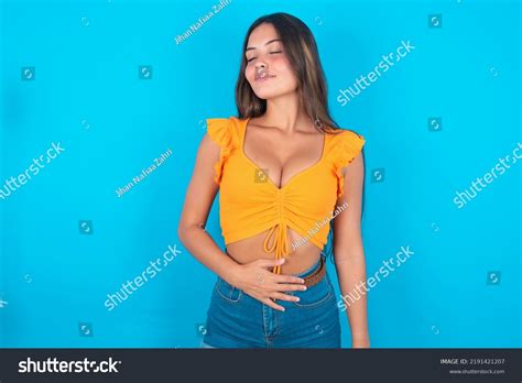 Satisfied Smiling Beautiful Brunette Woman Wearing Stock Photo 2191421207 Shutterstock