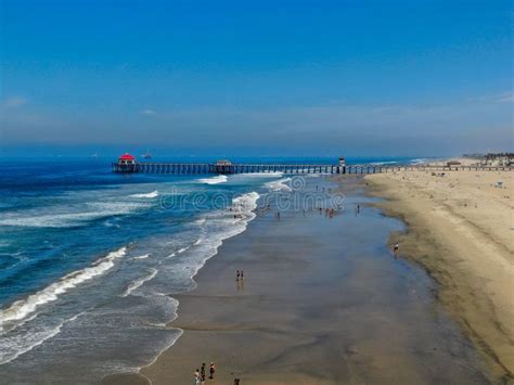 Aerial View Of Huntington Beach With The Pier On The Background