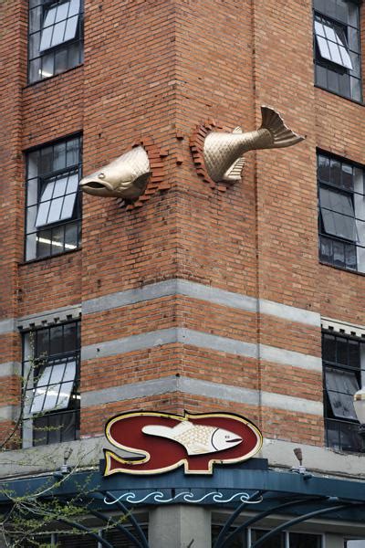 This Salmon Sculpture Passing Through A Brick Wall In Portland Oregon