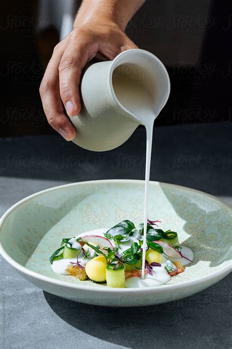 "Chef Pouring Sauce On Garnish" by Stocksy Contributor "Pietro Karras ...