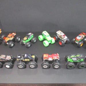 Collection Of 13 Different Hot Wheels 1 64 Scale Monster Trucks Excellent Condition Bigfoot Bone