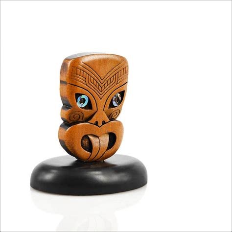 Maori carvings on a stand - from Kauri wood Aotearoa.co.nz