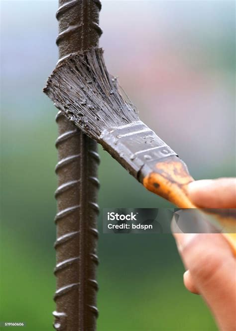 Painting An Iron Rod Stock Photo - Download Image Now - Activity, Close-up, Day - iStock