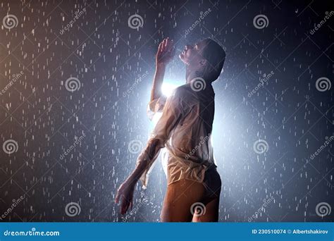Seductive Caucasian Woman In Candid Lingerie Posing Under Rain Water Drops Stock Photo Image