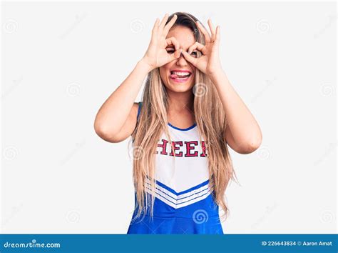 Young Beautiful Blonde Woman Wearing Cheerleader Uniform Doing Ok