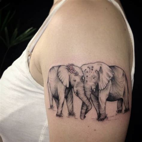 Upper Arm Tattoo Of Two Elephants In Love By Ivy