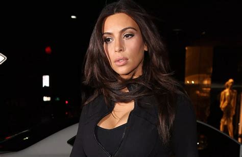 Kim Kardashian Shows Off Major Cleavage As She Hits The Gym Mirror