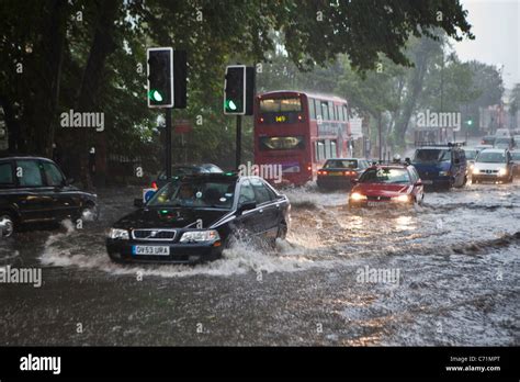 Heavy Rain Causes Flash Flooding In Stoke Newington London Traffic