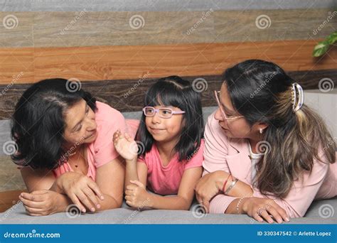 Latina Grandmother Mom And Daughter With Eyeglasses Spend Quality Time Show Their Love And