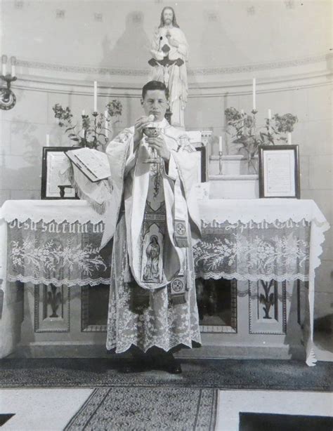 Original 1940s Young Catholic Priest Prepares The Eucharist During