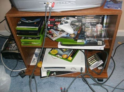 A Bunch Of Electronic Equipment Sitting On Top Of A Wooden Shelf Next