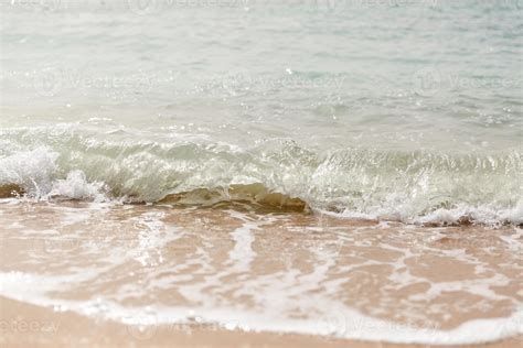 Close Up Sea Waves With Splashes On Sand Beach Close Up Stock