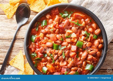 Mexican Pinto Bean Stew With Tomatoes Sausages Bacon And Onions Close