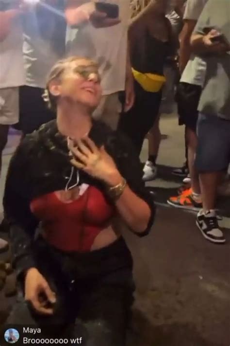 Model rubs horse poo in own face on busy street to 'send out good vibes