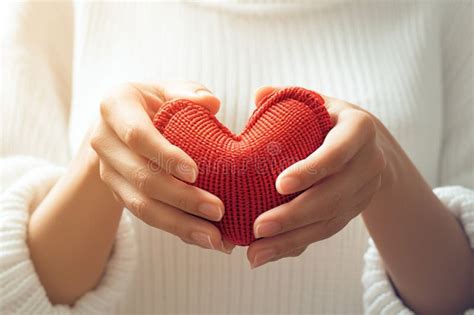 Charity Concept An Asian Woman Holds A Red Heart Symbol Stock