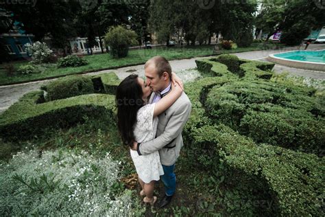 European Young Couple Hugging On The Background Of A Beautiful Building