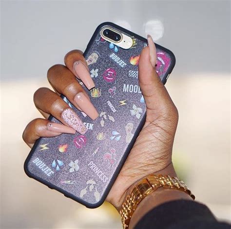 Womans Hand Holding Iphone Case With Stickers