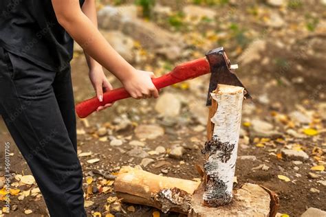 Female Strong Hands Chop Firewood With Axe For Bonfire Powerful Ax