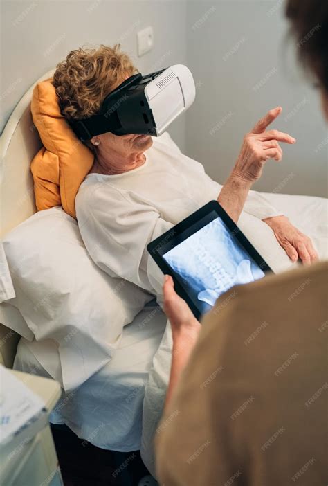Premium Photo | Older patient using virtual reality glasses to see her