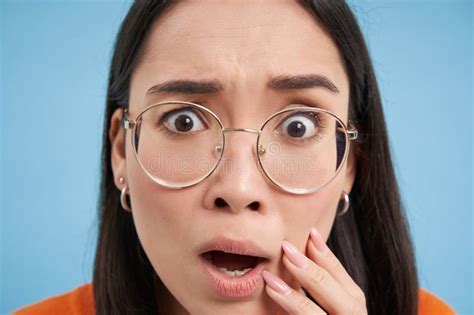 Close Up Portrait Of Japanese Girl In Glasses Looks Shocked And