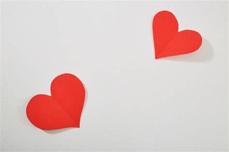 Premium Photo Close Up Of Red Heart Shapes On White Background