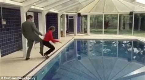 Video Shows Estate Agent Being Pushed In A Swimming Pool By Colleague