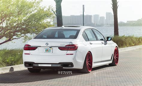 Stylish Transformation of White BMW 7-Series with Red Brushed Strasse ...