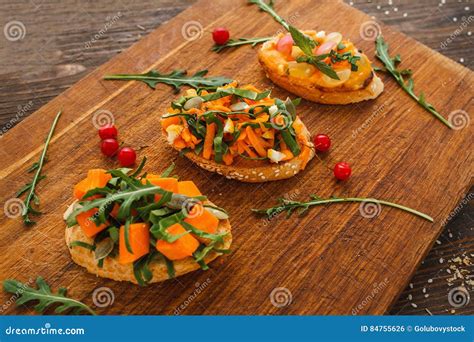 Vegetarian Canapes From Polenta With Cheese, Vegetables And Cress On A ...