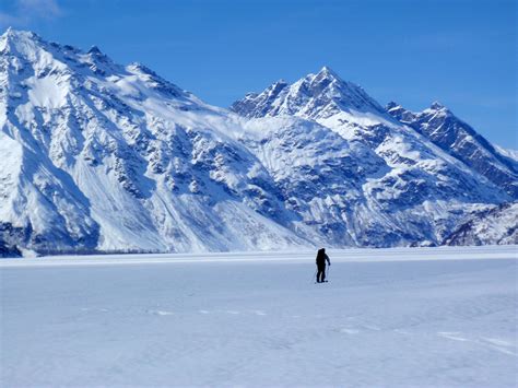 Frozen Crescent Lake landscape with mountains in the background image