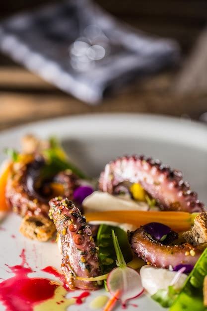 Premium Photo Octopus With Vegetable Salad On White Plate With