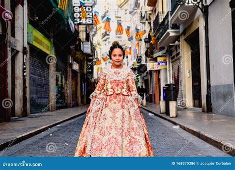 Portrait Of A Latina Fallera Girl Wearing The Traditional Valencian Costume Of Fallas Stock
