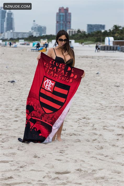 Claudia Romani Sexy Poses On South Beach In A Small Black Thong Bikini AZNude