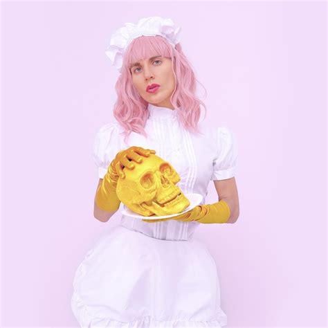 Premium Photo Pretty Blonde Girl In A Waiter Costume With Gold Skull Roleplaying Games
