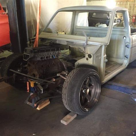 An Old Truck Is Being Worked On In A Garage