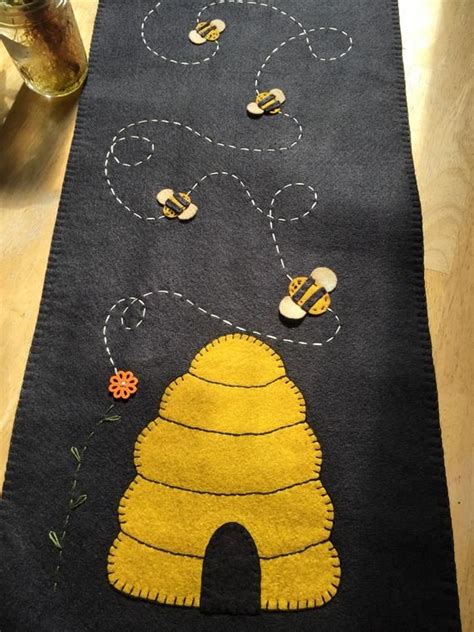 Primitive Bee Hive Skep Table Runner Is A Black Background With Hives