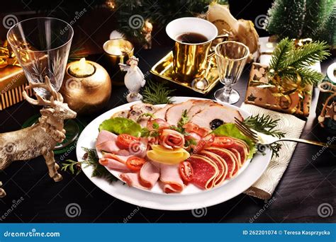 A Platter of Sliced Ham and Cured Meat for Christmas on Black Table ...