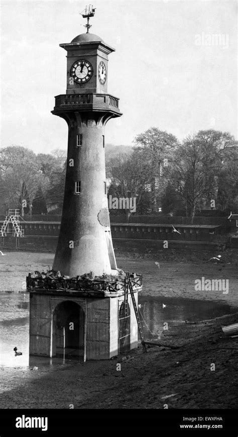 The water has been drained from Roath Park Lake for winter cleaning. Pictured is the lighthouse ...