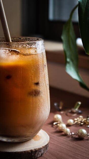 Premium Photo Close Up Of Glass Of Iced Coffee On Table