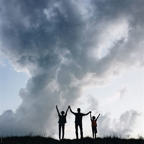 Silhouettes Of A Father With His Two Children By Stocksy Contributor