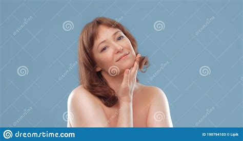 Happy Mature Woman Applies Skin Care Cream Touching Face With Hand Nude Woman Applying Anti Age