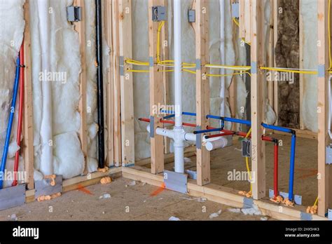 Buildt New Home Construction Featuring Hot And Cold Water Pex Plastic Plumbing Tubes Stock Photo