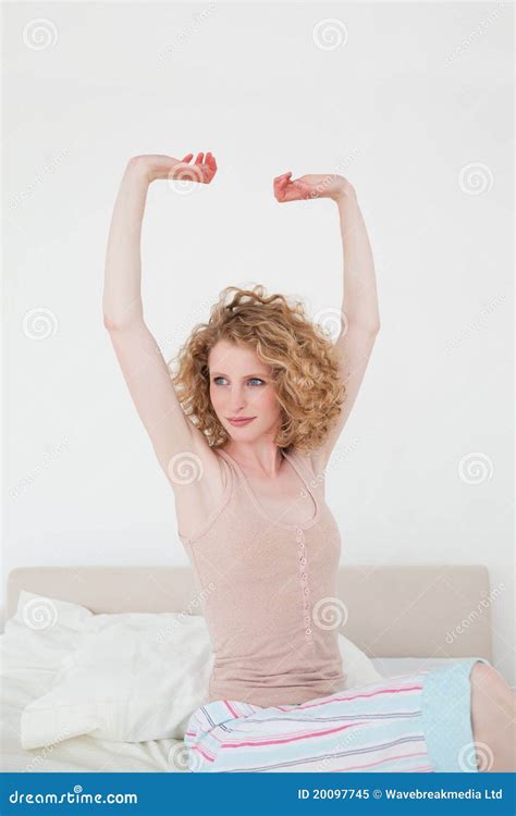 Attractive Blonde Female Stretching In Her Bedroom Stock Image Image Of Pillow Awake