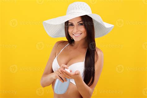 Sexy Woman In Bikini Posing Against Yellow Background Stock