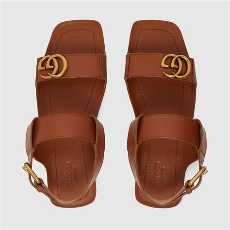 Shop The Womens Leather Sandal With Double G In Brown Leather At Guccicom Enjoy Free Shipping