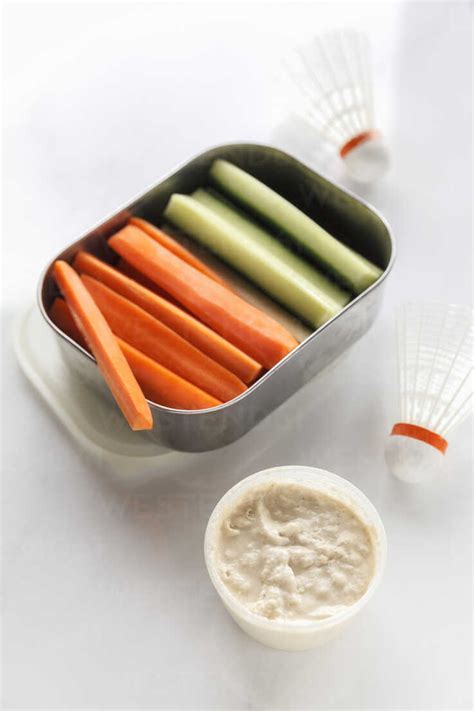 Shuttlecox Box Of Cucumber And Carrot Sticks And A Bowl Of Dip On