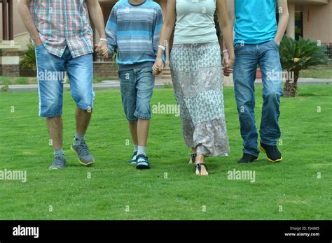 Family holding hands Stock Photo - Alamy