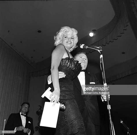 Actress Jayne Mansfield Presents A Golden Globe Award To Actor Mickey Rooney Who Is Collecting